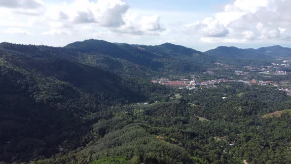 Aerial fly over green hill