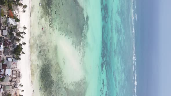 Vertical Video of the Ocean Near the Coast of Zanzibar Tanzania Aerial View