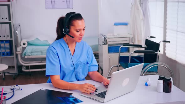 Healthcare Physician Prescribing Prescriptions for Patients on Phone