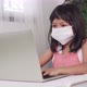 Funny Asian child learning class study online with a video calls from a notebook with a teacher - VideoHive Item for Sale