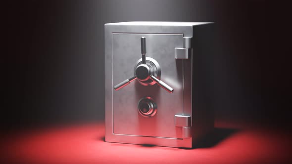 Empty steel safe on a red carpet in the spotlight.Vault doors are slowly opening