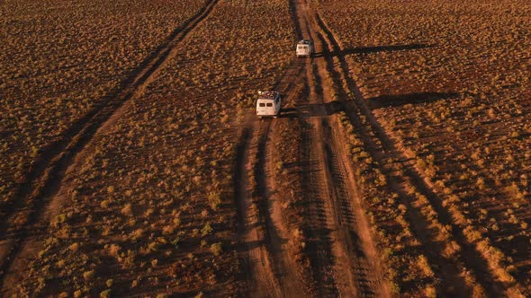 Aerial View Off Road 4X4 Car Driving Along Dirt Road Among the Desert