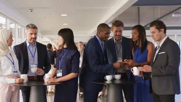 Business people talking during a coffee break at a convention