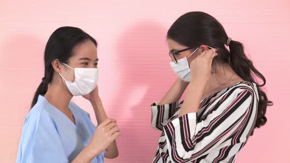 Happy Friends Take Off Face Mask and Hug Each Other Closely Together