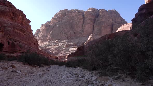 Walking Inside The Canyon On A Rocky Road To The Mountain Slope In Ancient City Of Petra