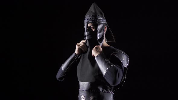 Mongolian Warrior in the Historical Period. Black background. alt