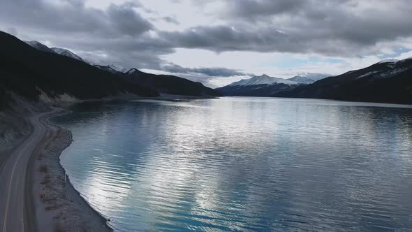 Aerial footage of the road near Muncho Lake in the mountains of Alberta, Canada