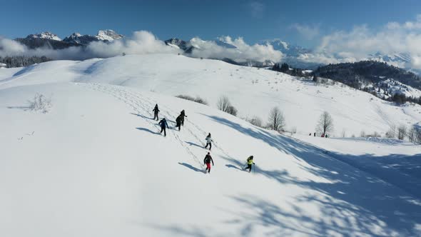 Aerial view of group of friends doing cross country ski in Onnion, France.