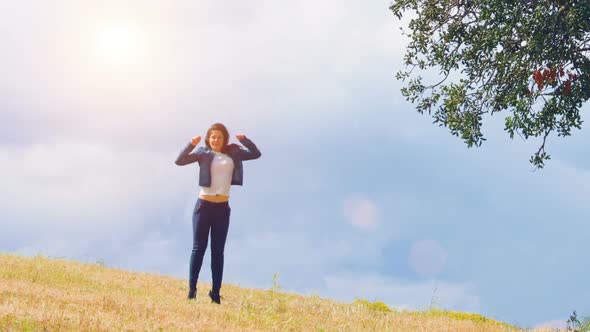 Happy Young Woman Enjoying Wonderful Life, Jumping at Field, Excited Person