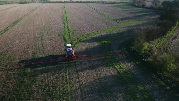 Tractor Spraying Fields on an Arable Farm with Glyphosate Herbicide