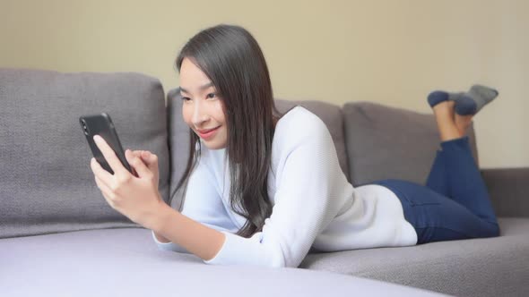 Young asian woman use smart phone