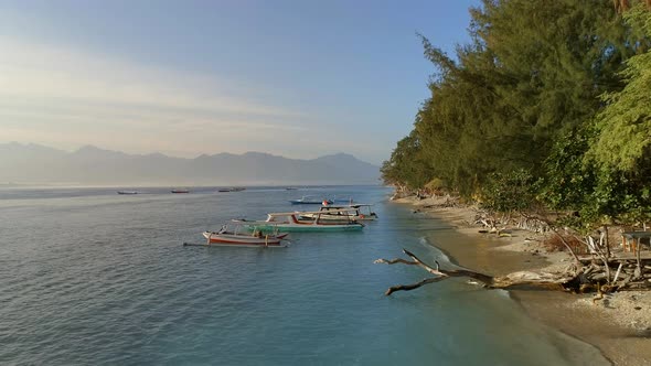 Picturesque Beach with Fishing and Tour Boats Moored to the Shore