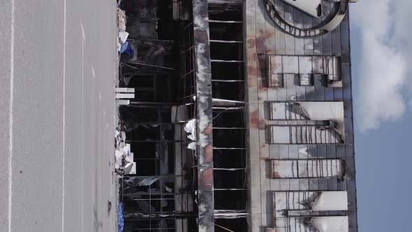 Vertical Video of the Consequences of the War in Ukraine  a Bombedout Shopping Center in Bucha