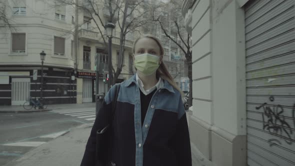 Woman Pedestrian in Mask Walking in the City