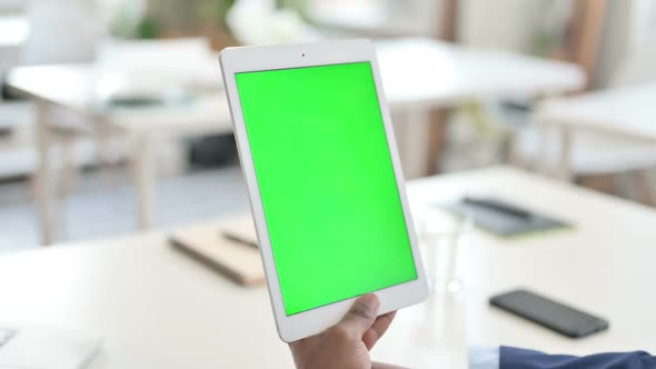 Businessman Watching Tablet with Green Chroma Key Screen