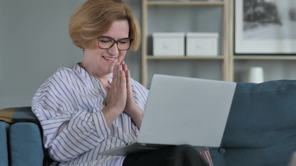 Excited Old Woman Celebrating Success, Working on Laptop