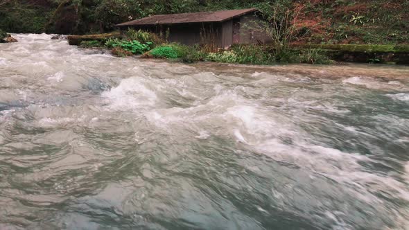 Close Up Shot of the River, Which Goes Into Waterfall, Next To the Chateau House