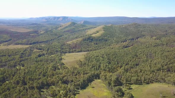 Aerial Shot Flying Over a Mountainous Forest