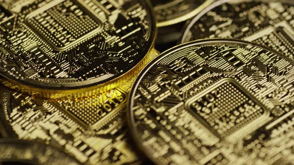 Rotating shot of Bitcoins (digital cryptocurrency) - BITCOIN 0595