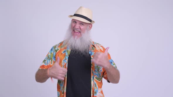 Happy Mature Bearded Tourist Man Giving Thumbs Up