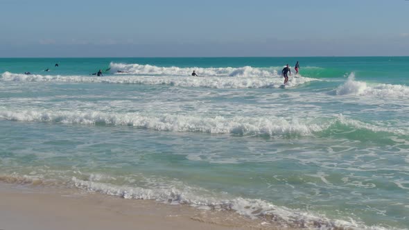 Small Waves Are Good for Training Surfers