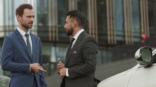 Business Partners Shaking Hands Outside Building