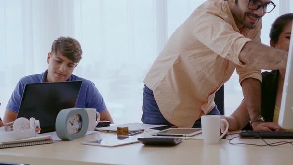 Group Meeting of Creative Business People Designer and Artist at Office Desk