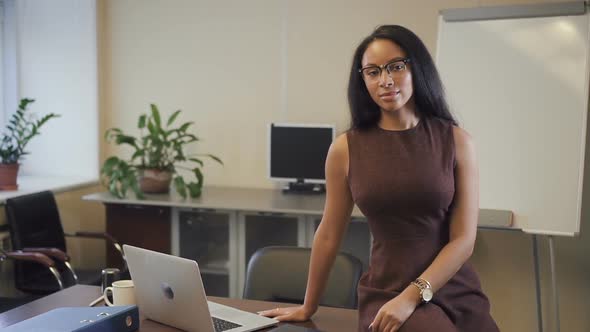 Attractive African American Businesswoman Smiling in Startup Office