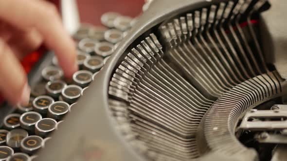 Close-up of typing on an antique typewriter with ink and ribbon