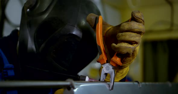 Closeup Portrait of a Welder in Gloves and Helmet Detail Works Welding Argon Welding.