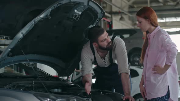 Maintenance Worker Checking Car alt