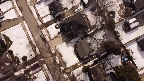 Aerial Video Drone Flying Over Neighborhood Covered In Snow Storm Aftermath