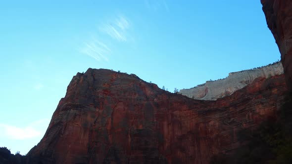 Majestic brown sandstone mountains of Zion National Park, Utah. Driving through them.