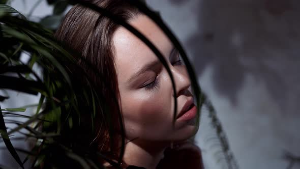 Woman in Plants is Shot for Advertising Swimwear Cosmetics for Face Care