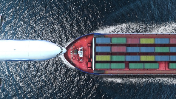 Airplane flies over Cargo ship  with containers in the sea- aerial