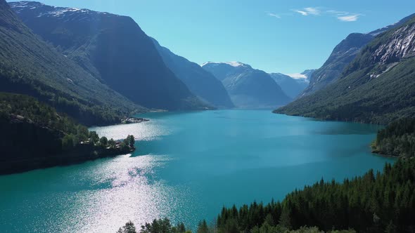 Full panoramic view of lake Lovatnet with Jostedal glacier on top of mountain in background - Stunni