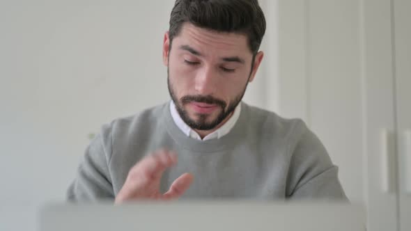 Close Up of Man Talking on Video Call on Laptop