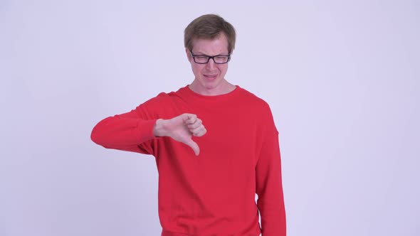 Stressed Young Man Getting Bad News and Giving Thumbs Down