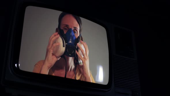 Woman wearing Gas Mask on a Retro Television.