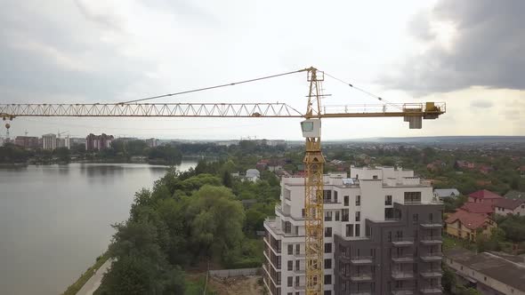 Aerial View of Tower Crane and Residential Building Under Construction