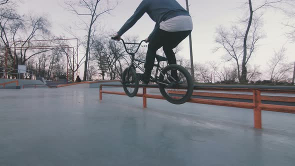 Bmx Rider Doing Tricks in Concrete Skatepark Slow Motion