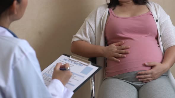 Pregnant Woman and Gynecologist Doctor at Hospital