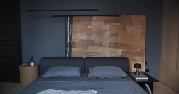 The Modern Minimalist Bedroom with Black and Gray Tone Large Paintings and Wood