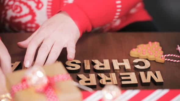 Wood Merry Christmas sign and traditional gingerbread cookies home made.