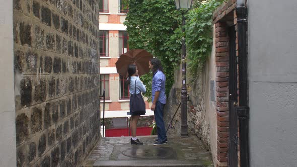 Couple under the rain in Paris, France