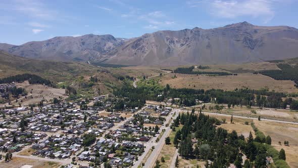 Dolly in flying above Esquel valley with Andean mountain in background, Patagonia Argentina