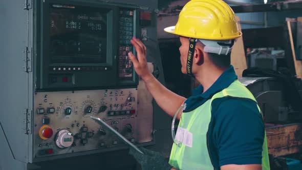 Smart Factory Worker Using Machine in Factory Workshop