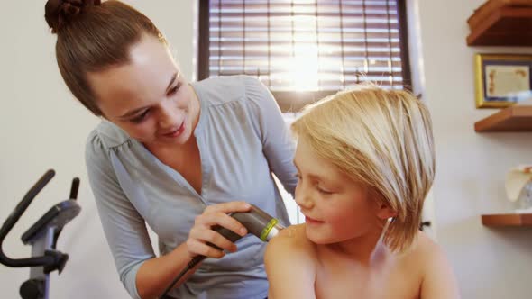 Physiotherapist giving back massage to a boy 4k