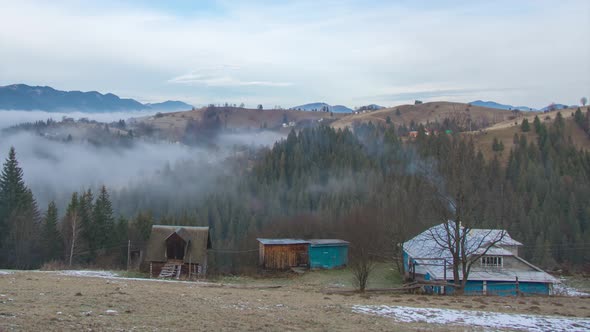 Timelapse Fog Over the Forest and the House in the Carpathian Mountains