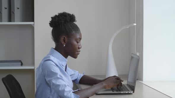 Afro American Woman Working on Laptop